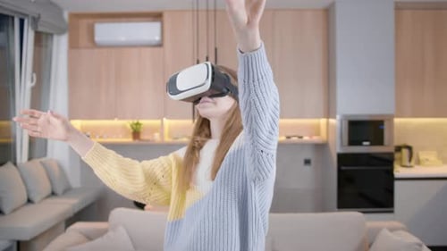 Young Woman Using Virtual Reality Headset in Apartment