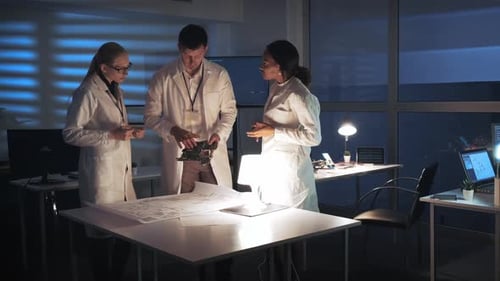 Team of Scientists Working on Technology in Lab