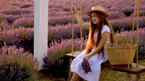 Girl on Swing in a Lavender Field at Sunset
