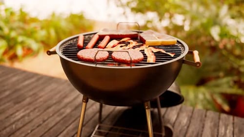 Grill at the garden. Traditional barbeque. Steaks, sausages, bacon and burgers.