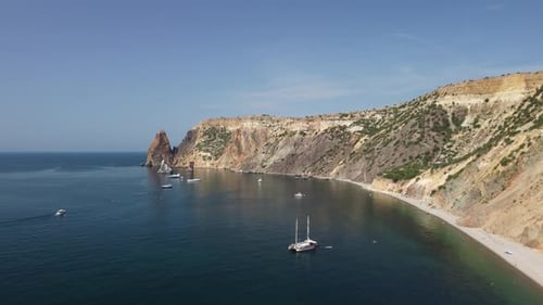 Aerial View From Above on Calm Azure Sea and Volcanic Rocky Shores