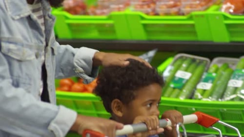 Father Stroking Son’s Head at Supermarket