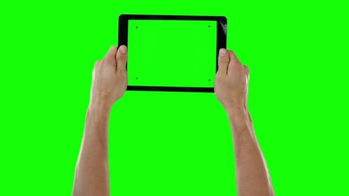 Hands holding digital tablet