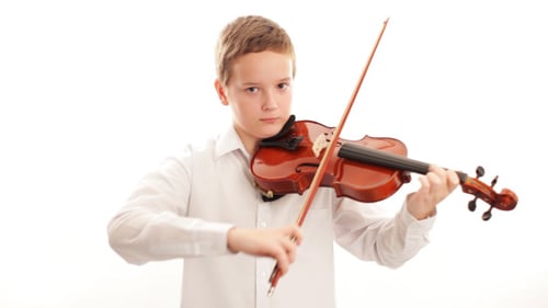 Child Plays Violin in Front of White Background