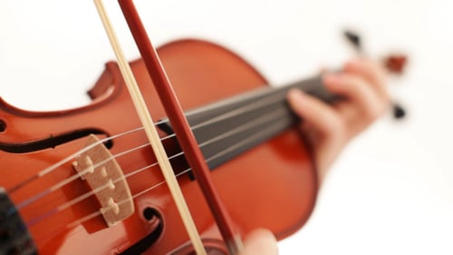 Close Up Violin Played with Bow Indoors