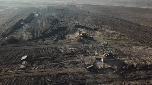 Drone Footage of a Huge Construction Site with a Bulldozer and an Excavator
