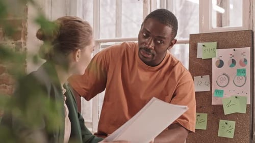 Business Colleagues Discussing Documents in an Office