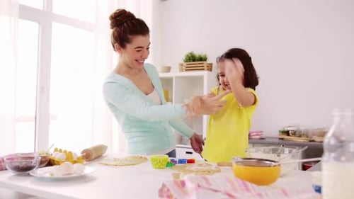 Happy Mother and Child Baking Cookies Together