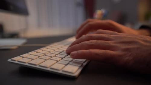 Close-up image of working on keyboard