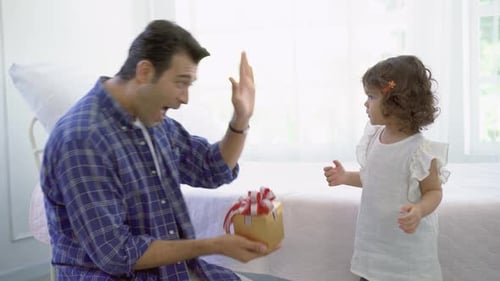 Father and Child Celebrate Birthday with Gift