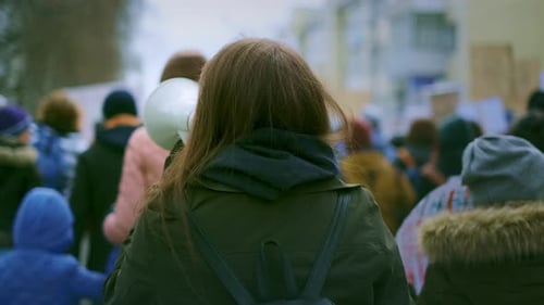 Crowd of People Marching in City Protest