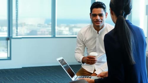 Business Meeting with Laptop in Modern Office