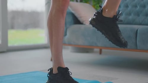 Man Exercising at Home Doing Leg Workouts