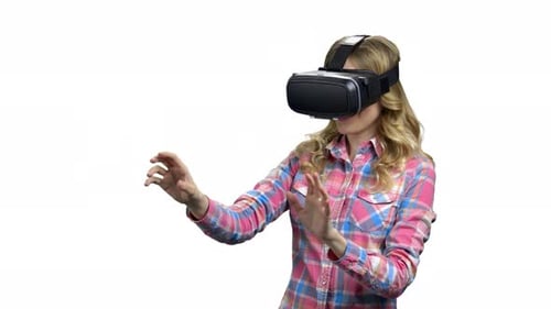 Woman Experiences Virtual Reality Headset on White Background
