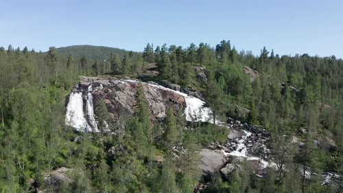 Flying From Above Rocky Streams Waterfalls and the Vast Forest