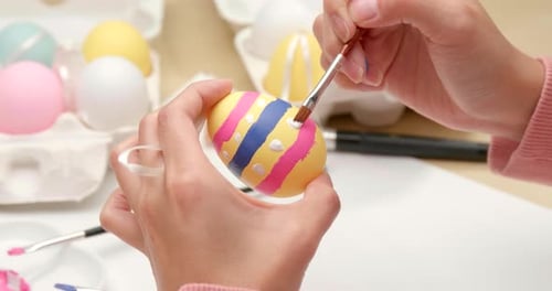 Painting on egg for Easter holiday