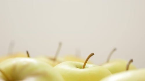 Juicy fresh apple fruit background with petioles slow tilt 4K 3840X2160 30fps UltraHD video - Tiltin