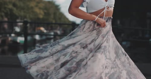 Woman with Hula Hoop on City Street