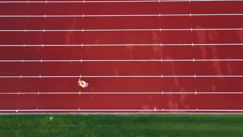 Athlete Running a Short Distance at the Stadium