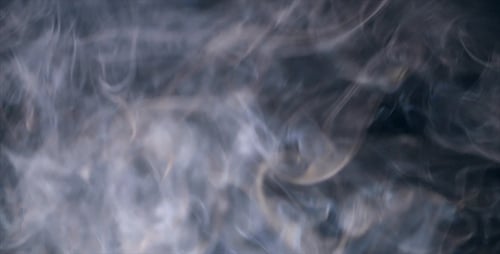 Abstract Smoke Pattern Moving Slowly on Dark Background