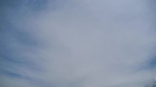 White Clouds Float in a Deep Blue Sky