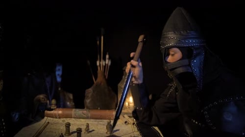 Armored Strategist Planning by Candlelight