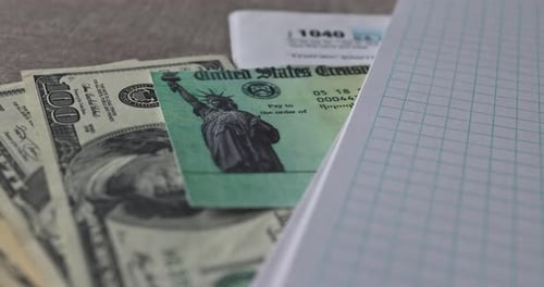 Close Up of Tax Payment Documents and Money