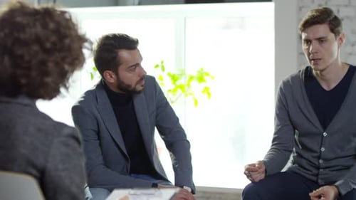 Adults in Group Therapy Session Communicate and Connect