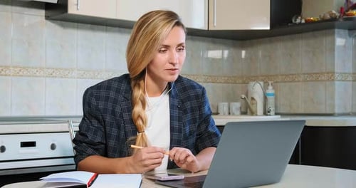 Woman in Kitchen Video Call Working From Home