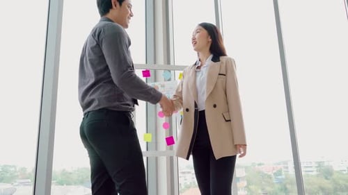 Business People Handshake in Corporate Office