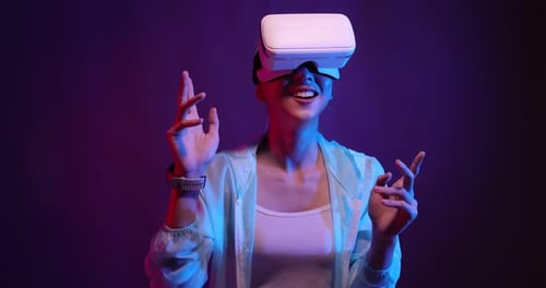 Young Woman Experiencing Virtual Reality Headset Technology