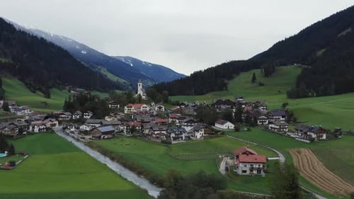 Small town in Italy taken from above with DJI Mavic 2 Pro, movement: orbit. The town is located in T