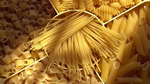 Variety of Uncooked Pasta Shapes in Sections