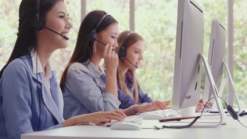 Customer Support Agent or Call Center with Headset Talking to Customer on Phone