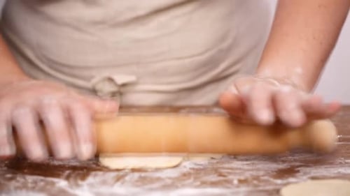 Step by step. Rolling dough for home made empanadas.