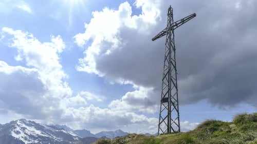 Time Lapse On Top Of A Mountain With A Cross With Moving Clouds1