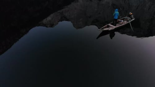 Boat on a Lake Surrounded by Lush Mountains