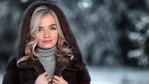 Portrait of Lady Smiling Posing in Hood Fur Coat Outdoor