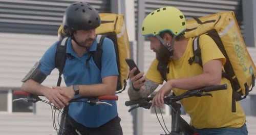 Bike Messengers Check Smartphone