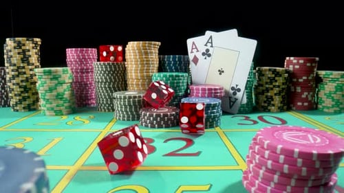 Set of Colorful Chips Playing Cards and Red Dice on a Gaming Table for Gambling in a Casino