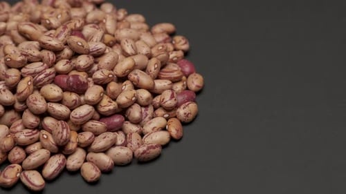 Pinto Beans Piled on Black Surface