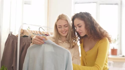 Famous and Successful Female Fashion Designer Giving Consultation to Her Visitor Discussing New Blue