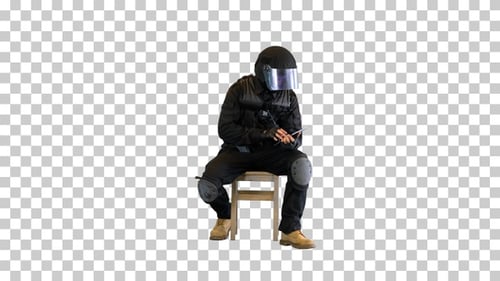 Tactical police unit sitting and using, Alpha Channel