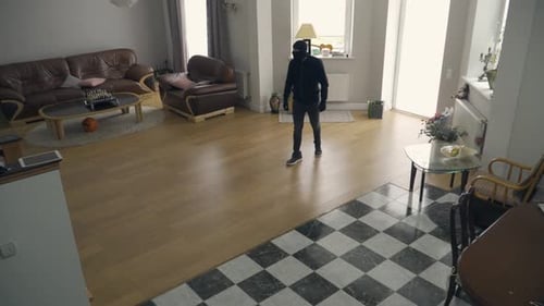 Masked Person Walking Indoors