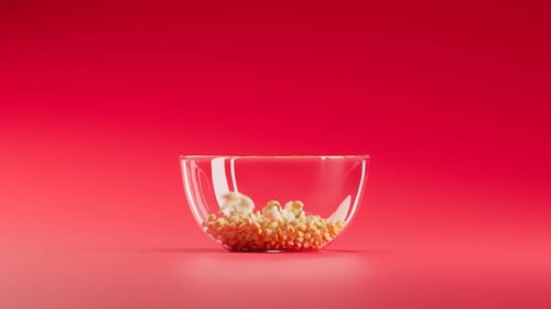 Popcorn Popping Animation Filling Glass Bowl on Red