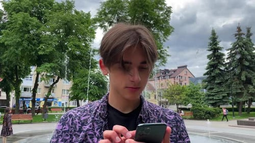 Man Using Touch Mobile Phone Outdoor Close Up Man Walking Street