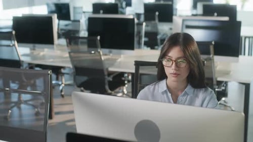 Professional Creative Woman Sitting At His Desk In Home Office Studio Working Surfing On a Laptop