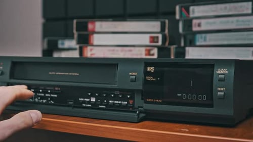 Insert VHS Cassette Into VCR and Push Play Button