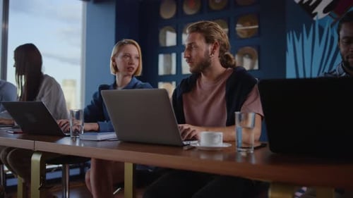 Multiracial Group of People Chatting in Coworking. Workers Speaking in Office