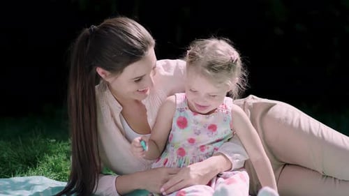 Family In Nature. Mother And DaughterHaving Fun At Park